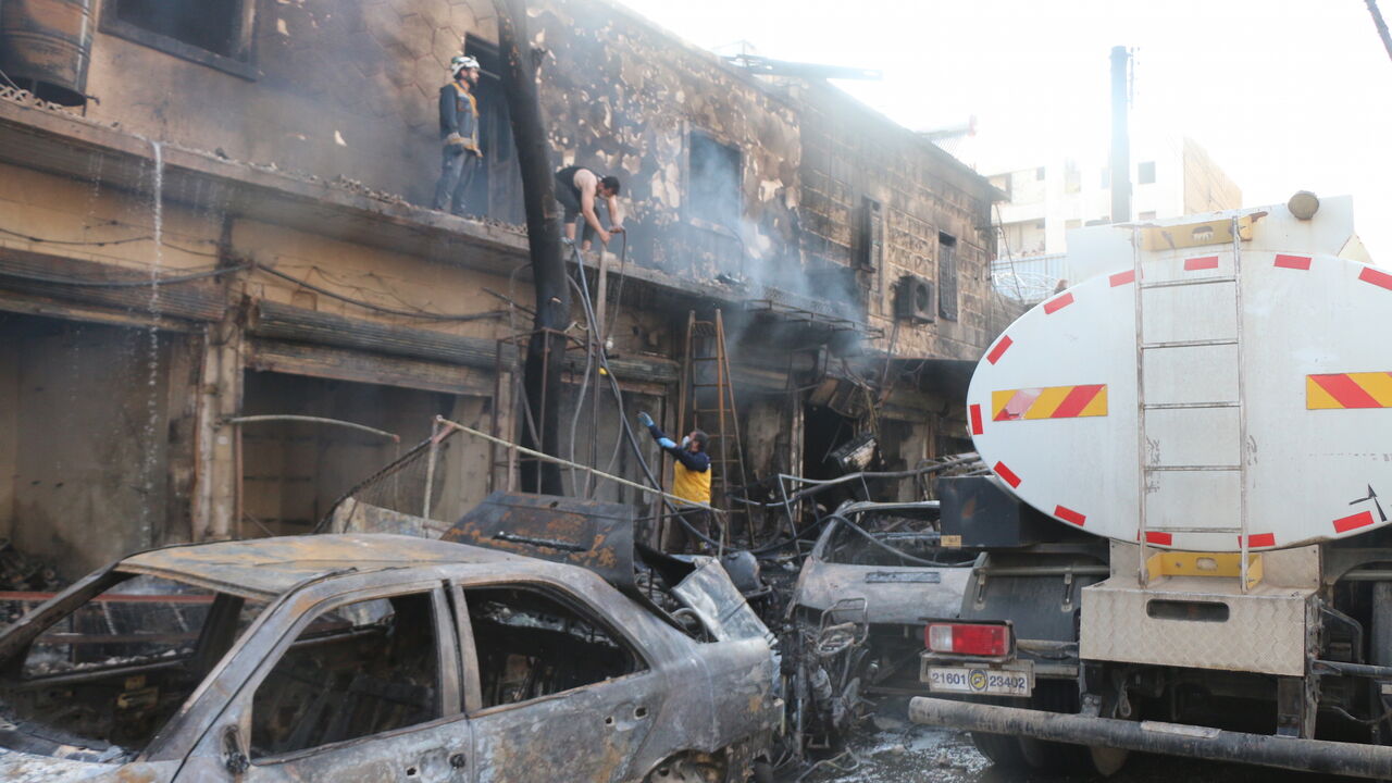 1211233568 AFRIN, SYRIA - APRIL 28: (----EDITORIAL USE ONLY √¢ MANDATORY CREDIT - "SYRIAN CIVIL DEFENSE (WHITE HELMETS) / HANDOUT" - NO MARKETING NO ADVERTISING CAMPAIGNS - DISTRIBUTED AS A SERVICE TO CLIENTS----) Civil defense members try to extinguish fire after an attack carried out by PKK, listed as a terrorist organization by Turkey, the U.S. and the EU, and Syrian Kurdish YPG militia, which Turkey regards as a terror group, in northwestern Syria's Afrin on April 28, 2020. At least 40 civilians, including 11 chil