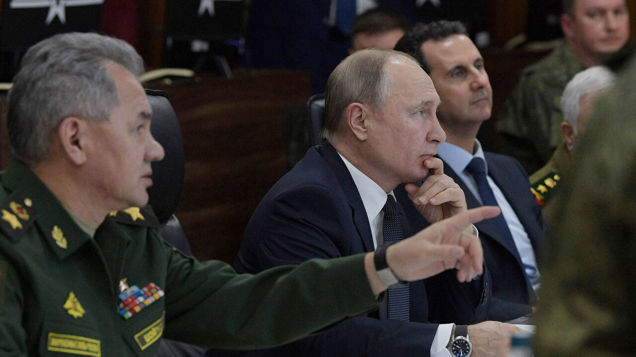 SYRIA-RUSSIA/ Russian President Vladimir Putin, Defence Minister Sergei Shoigu and Syrian President Bashar al-Assad attend a meeting in Damascus, Syria January 7, 2020. Sputnik/Alexei Druzhinin/Kremlin via REUTERS ATTENTION EDITORS - THIS IMAGE WAS PROVIDED BY A THIRD PARTY. - RC29BE9XR6LF