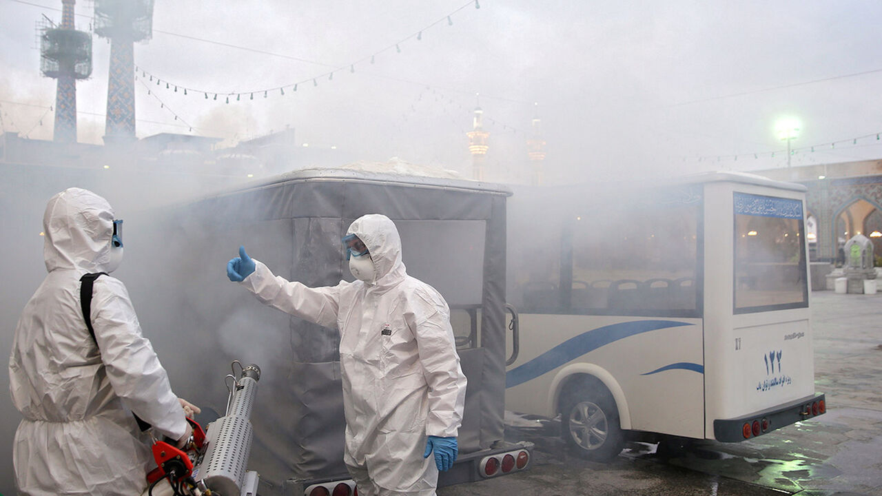 CHINA-HEALTH/IRAN-TOLL Members of the medical team spray disinfectant to sanitize outdoor place of Imam Reza's holy shrine, following the coronavirus outbreak, in Mashhad, Iran February 27, 2020. Picture taken February 27, 2020. WANA (West Asia News Agency) via REUTERS ATTENTION EDITORS - THIS PICTURE WAS PROVIDED BY A THIRD PARTY - RC2FAF91QZ3P