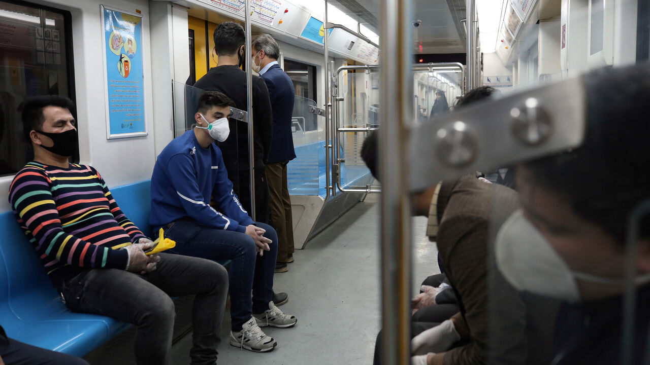 HEALTH-CORONAVIRUS/IRAN People wear protective face masks, following the outbreak of coronavirus, as they sit in a metro in Tehran, Iran March 17, 2020. WANA (West Asia News Agency)/Ali Khara via REUTERS ATTENTION EDITORS - THIS PICTURE WAS PROVIDED BY A THIRD PARTY - RC2PLF9NILL2