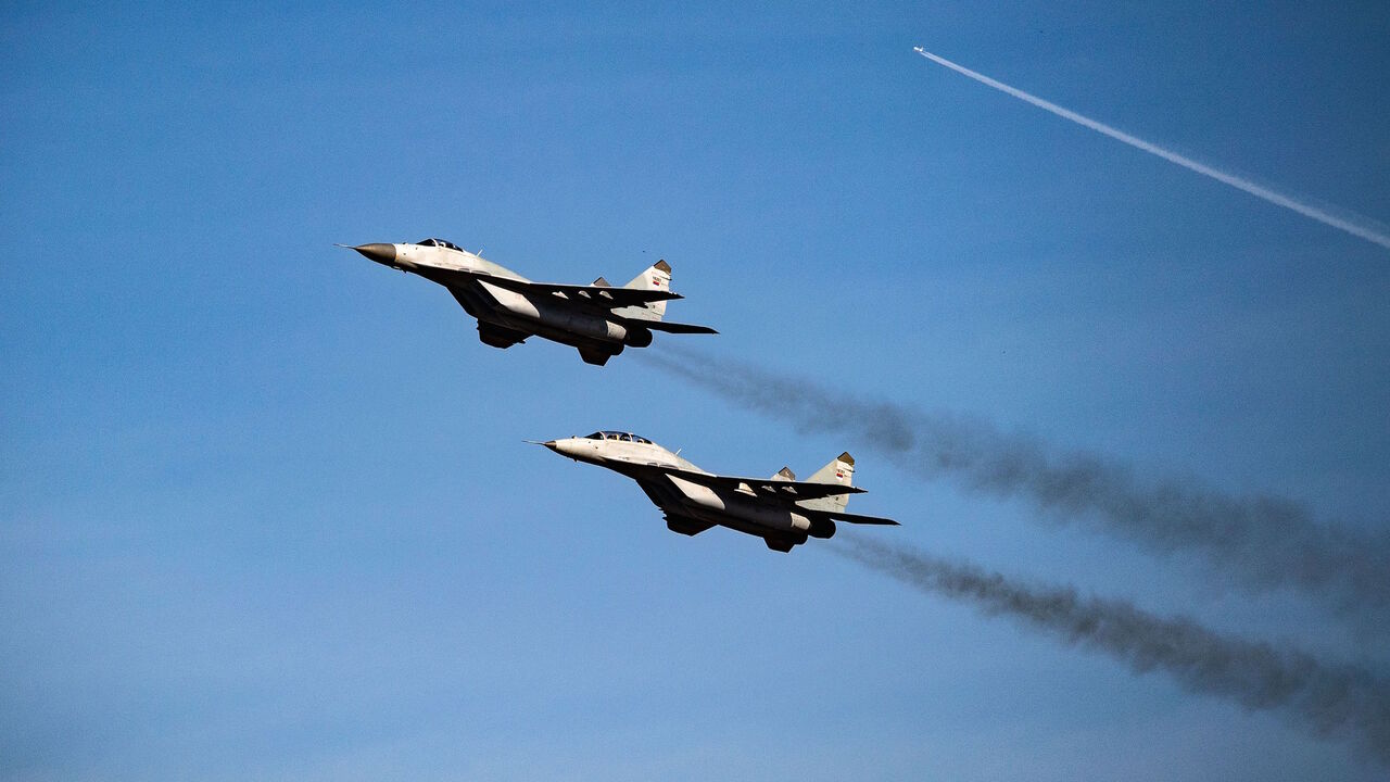 1045557648 Serbian Air Force Mig 29 fighter planes fly over the Batajnica military airport near capital Belgrade, on October 4, 2018. - The members of Serbias Air Force and Anti-Aircraft Defence and their colleagues from Russias Aerospace Force started an air-tactical exercise BARS 2018 on October 1, 2018. Serbias Defence Ministry said in a statement that the goal of the exercise to last through October 6 was to raise the level of the operational capabilities of the two countries air forces. That is the fourth such ex