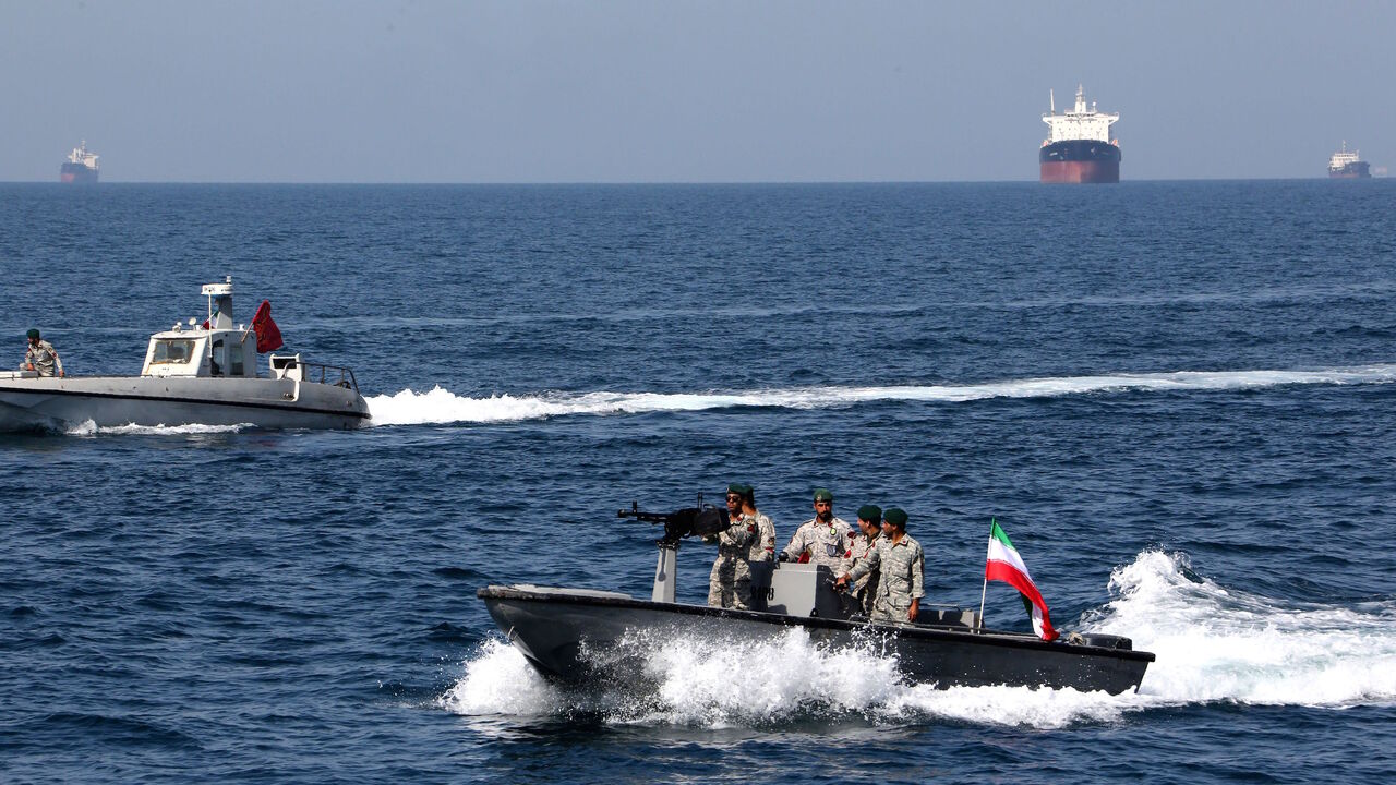 1140242763 Iranian soldiers take part in the "National Persian Gulf day" in the Strait of Hormuz, on April 30, 2019. - The date coincides with the anniversary of a successful military campaign by Shah Abbas the Great of Persia in the 17th century, which drove the Portuguese navy out of the Hormuz Island, after which is named the waterway which separates the Gulf from the Sea of Oman. (Photo by ATTA KENARE / AFP) (Photo credit should read ATTA KENARE/AFP via Getty Images)