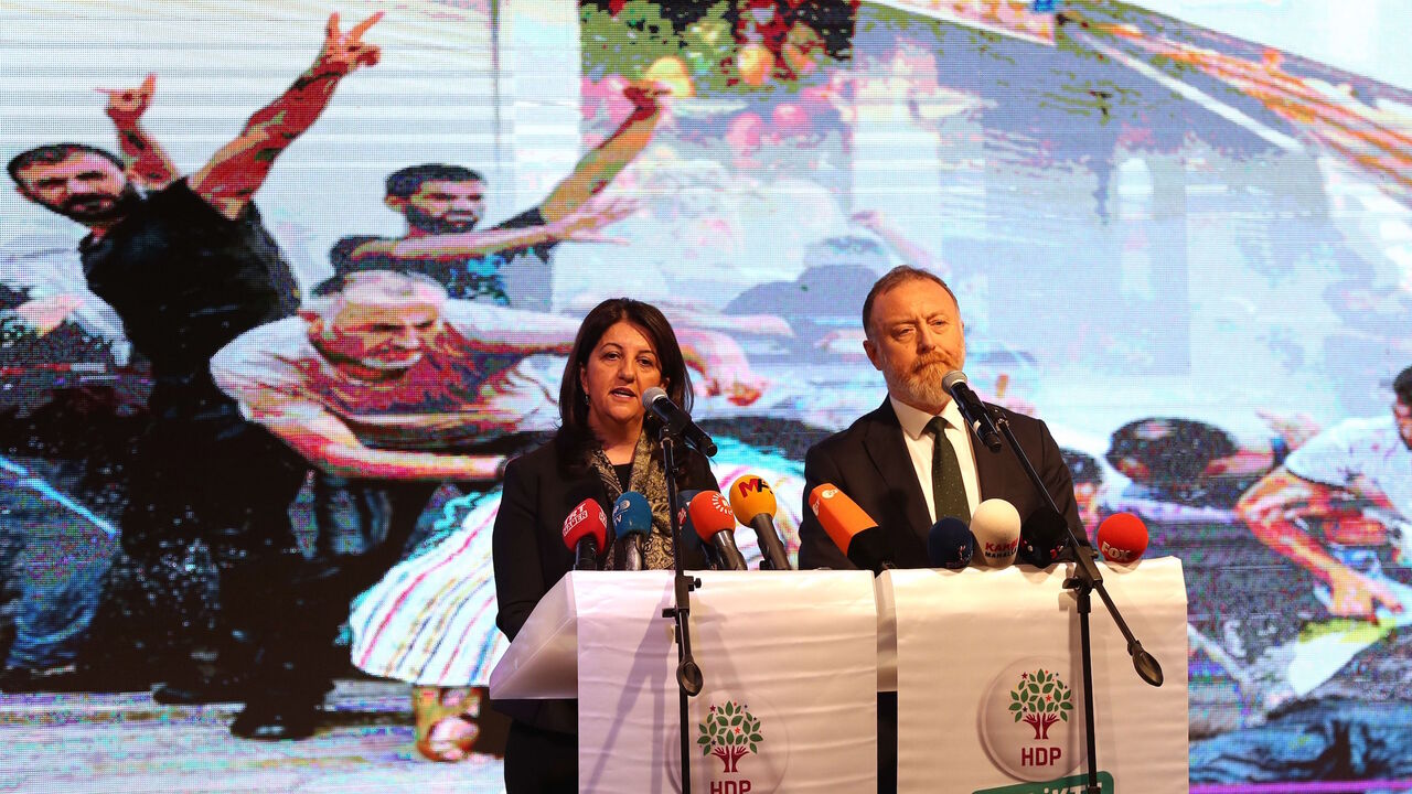 1183590047 Co-leaders of pro-Kurdish Peoples' Democratic Party (HDP) Pervin Buldan (L) and Sezai Temelli speak on stage during a meeting in Ankara, on November 20, 2019 - Turkey's main pro-Kurdish Peoples' Democratic Party (HDP) will discuss in Ankara a possible withdrawal from parliament in response to the crackdown against it. In recent weeks, several mayors in the southeast have been sacked or detained. (Photo by Adem ALTAN / AFP) (Photo by ADEM ALTAN/AFP via Getty Images)
