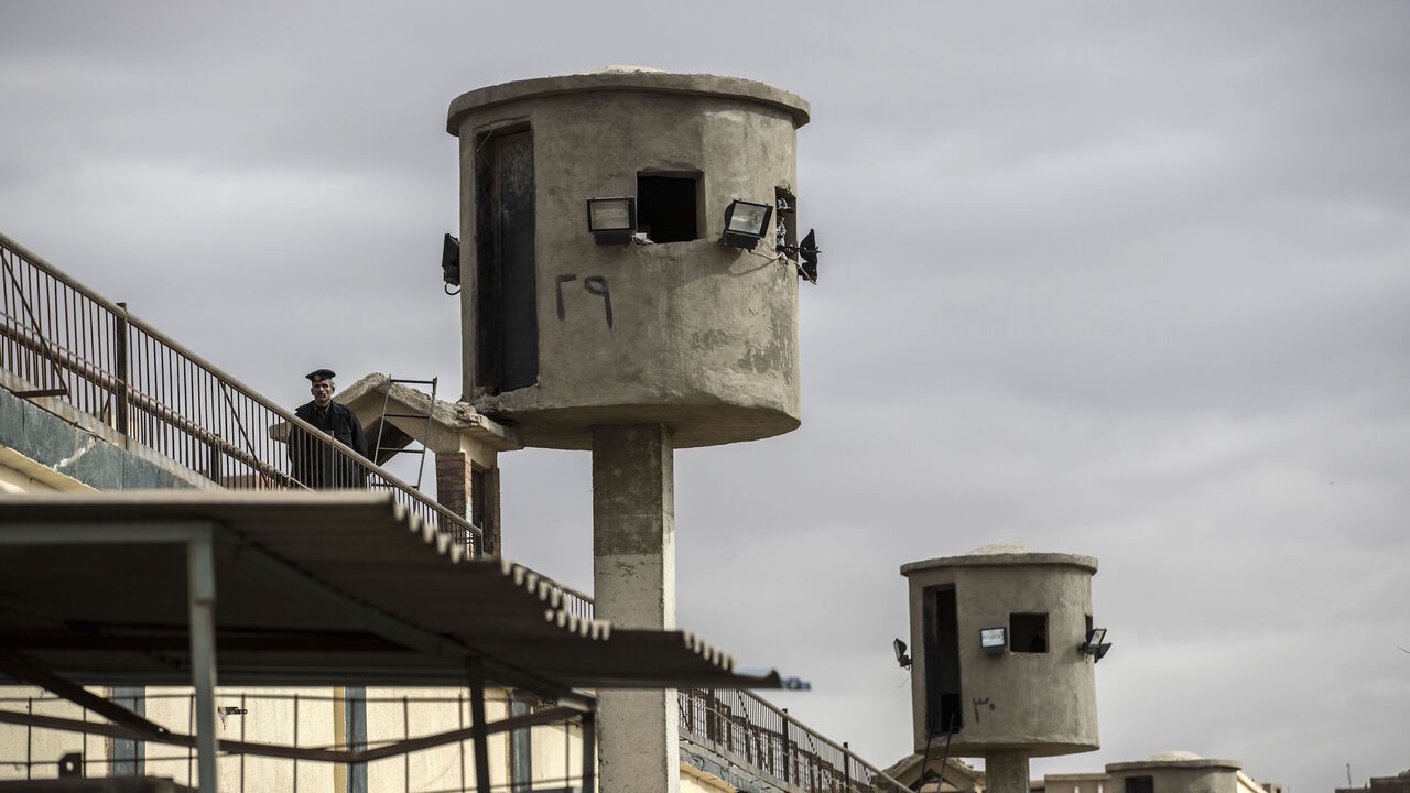 1200174849 A picture taken during a guided tour organised by Egypt's State Information Service on February 11, 2020, shows an Egyptian policeman near watch towers at Tora prison in the Egyptian capital Cairo. (Photo by Khaled DESOUKI / AFP) (Photo by KHALED DESOUKI/AFP via Getty Images)