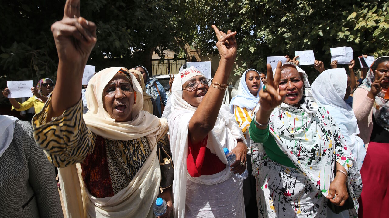 1205968036 Women chant slogans during a demonstration calling for the repeal of family law in Sudan, on the occasion of International Women's Day, outside the Justice Ministry headquarters in the capital Khartoum on March 8, 2020. - Under ousted president Omar al-Bashir's Islamist regime, a notorious "public order" law was used to have women publicly flogged or imprisoned for "indecent" dress or for drinking alcohol, seen as "indecent and immoral acts". Sudan's new government last November revoked the legislation -- b