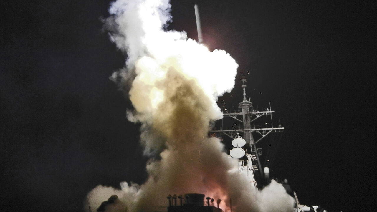 LIBYA-USA/MILITARY Arleigh Burke-class guided-missile destroyer USS Barry (DDG 52) launches a Tomahawk missile in support of Operation Odyssey Dawn in the Mediterranean Sea in this handout photo March 19, 2011. This was one of approximately 110 cruise missiles fired from U.S. and British ships and submarines that targeted about 20 radar and anti-aircraft sites along Libya's Mediterranean coast. Joint Task Force Odyssey Dawn is the U.S. Africa Command task force established to provide operational and tactical command and contr