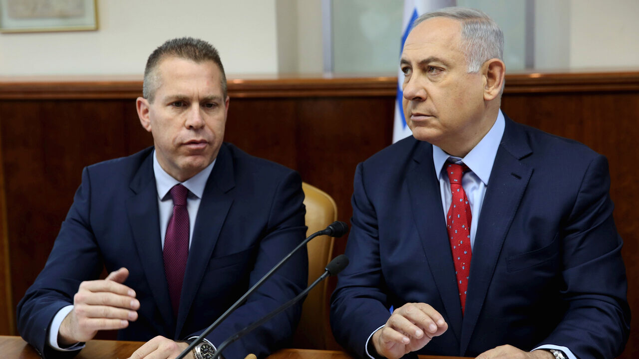 FILE PHOTO: Israeli Prime Minister Benjamin Netanyahu (R) sits next to Israeli Public security Minister Gilad Erdan during the weekly cabinet meeting in Jerusalem April 10, 2016. REUTERS/Gali Tibbon/Pool/File photo - RC17175E03C0