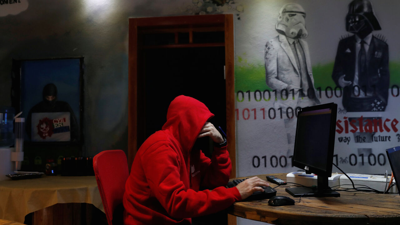 A man takes part in a training session at Cybergym, a cyber-warfare training facility backed by the Israel Electric Corporation, at their training center in Hadera, Israel  July 8, 2019. REUTERS/Ronen Zvulun - RC1118AE8A50