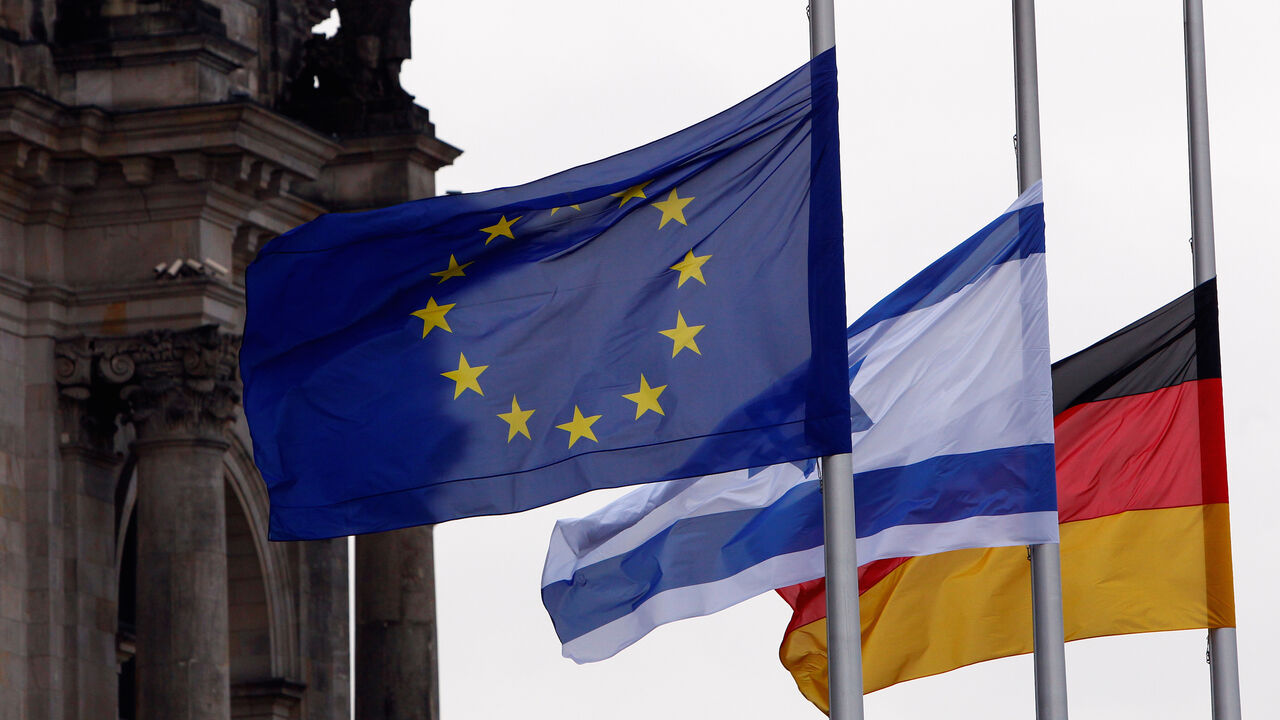 Flags of EU, Israel and Germany flutter next to the Bundestag ahead of Israeli President Reuven Rivlin speech in Germany’s lower house of parliament to commemorate the victims of the Nazi dictatorship, January 29, 2020. REUTERS/Michele Tantussi - RC2LPE9P7DWC