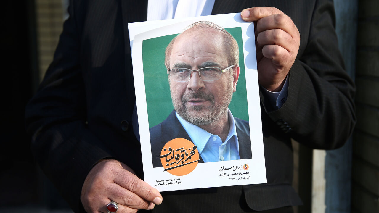A man holds a poster of Mohammad Baqer Qalibaf one of parliamentary candidate in Tehran, Iran February 18, 2020. Picture taken February 18, 2020, Nazanin Tabatabaee/WANA (West Asia News Agency) via REUTERS ATTENTION EDITORS - THIS IMAGE HAS BEEN SUPPLIED BY A THIRD PARTY. - RC2Q3F9OA8S5