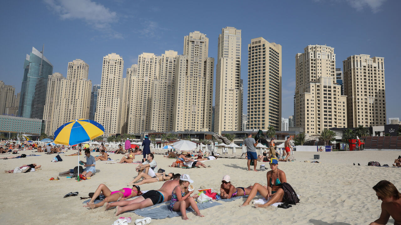 People are seen on Jumeirah Beach residence, following the outbreak of coronavirus disease (COVID-19), in Dubai, United Arab Emirates, March 19, 2020. REUTERS/Christopher Pike - RC24NF9KLRML