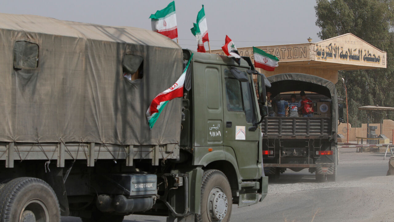 Iranian and Syrian flags flutter on a truck carrying humanitarian aid in Deir al-Zor, Syria September 20, 2017. Picture taken September 20, 2017. REUTERS/Omar Sanadiki - RC1C8E382200