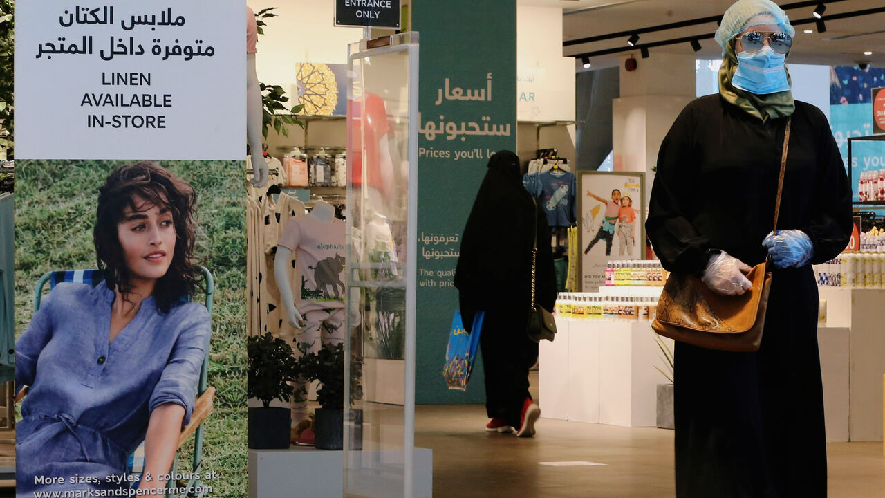 A woman wearing a protective mask walks at a shopping mall after the Saudi government eased a curfew and allowed stores to open, following the outbreak of the coronavirus disease (COVID-19), in Riyadh, Saudi Arabia May 2, 2020. REUTERS/Ahmed Yosri - RC2JGG9YJCK0