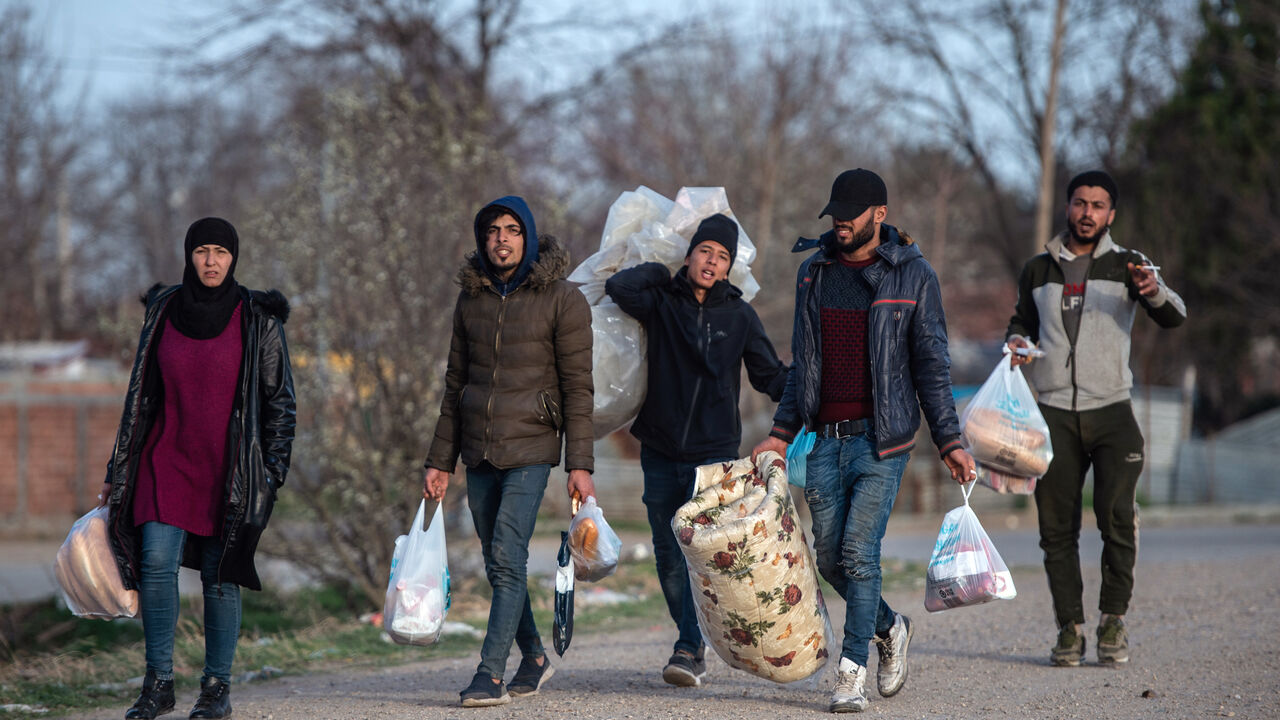 1211179568 EDIRNE, TURKEY - MARCH 08: Refugees and migrants walk on a road towards the Pazarkule Border Crossing between Turkey and Greece on March 08, 2020 in Edirne, Turkey. Thousands of refugees and migrants have flocked to the Greece, Turkey border after Turkey announced that it would open border gates for a period of 72hrs to allow refugees to cross into European countries after thirty three Turkish soldiers were killed in a Syrian air raid in Idlib. (Photo by Burak Kara/Getty Images)