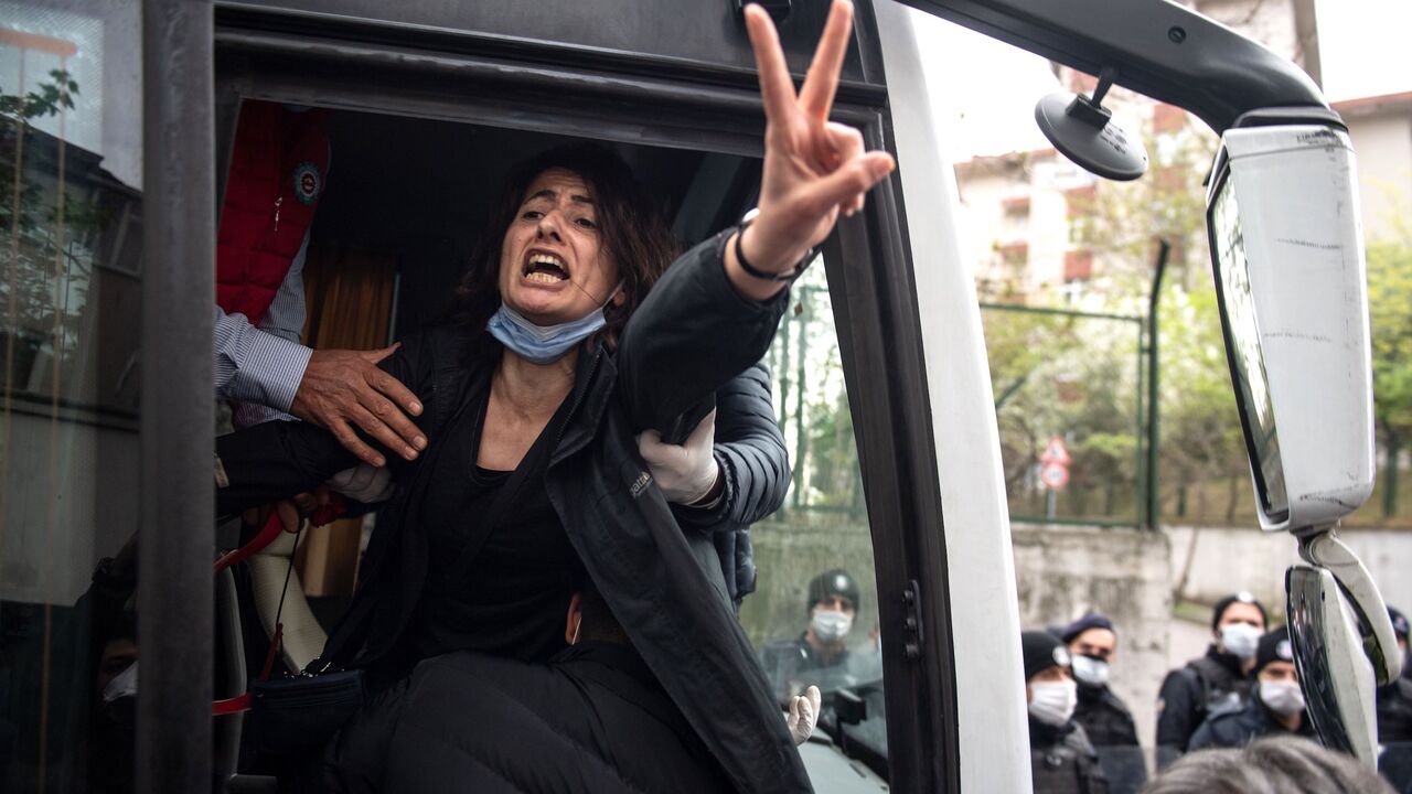 1211435246 TOPSHOT - Police detain a demonstrator during a May Day rally marking the international day of the worker in Istanbul, on May 1, 2020, as the country tries to curb the spread of the coronavirus, COVID-19. - Police in Istanbul detained several demonstrators who tried to march toward Istanbul's symbolic Taksim Square to mark May Day in defiance of the lockdown imposed by the government due to the coronavirus outbreak. (Photo by Bulent Kilic / AFP) (Photo by BULENT KILIC/AFP via Getty Images)