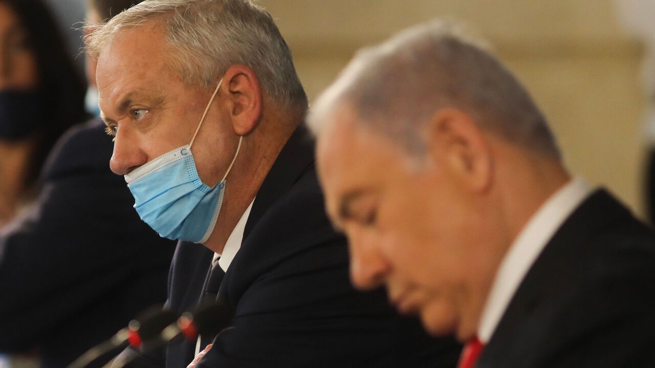 1218043200 Israeli Prime Minister Benjamin Netanyahu and Alternate PM and Defence Minister Benny Gantz attend the weekly cabinet meeting in Jerusalem on June 7, 2020. - Netanyahu urged world powers to reimpose tough sanctions against Iran, vowing to curb Tehran's regional "aggression" hours after another deadly strike on pro-Iranian fighters in Syria. (Photo by Menahem KAHANA / AFP) (Photo by MENAHEM KAHANA/AFP via Getty Images)