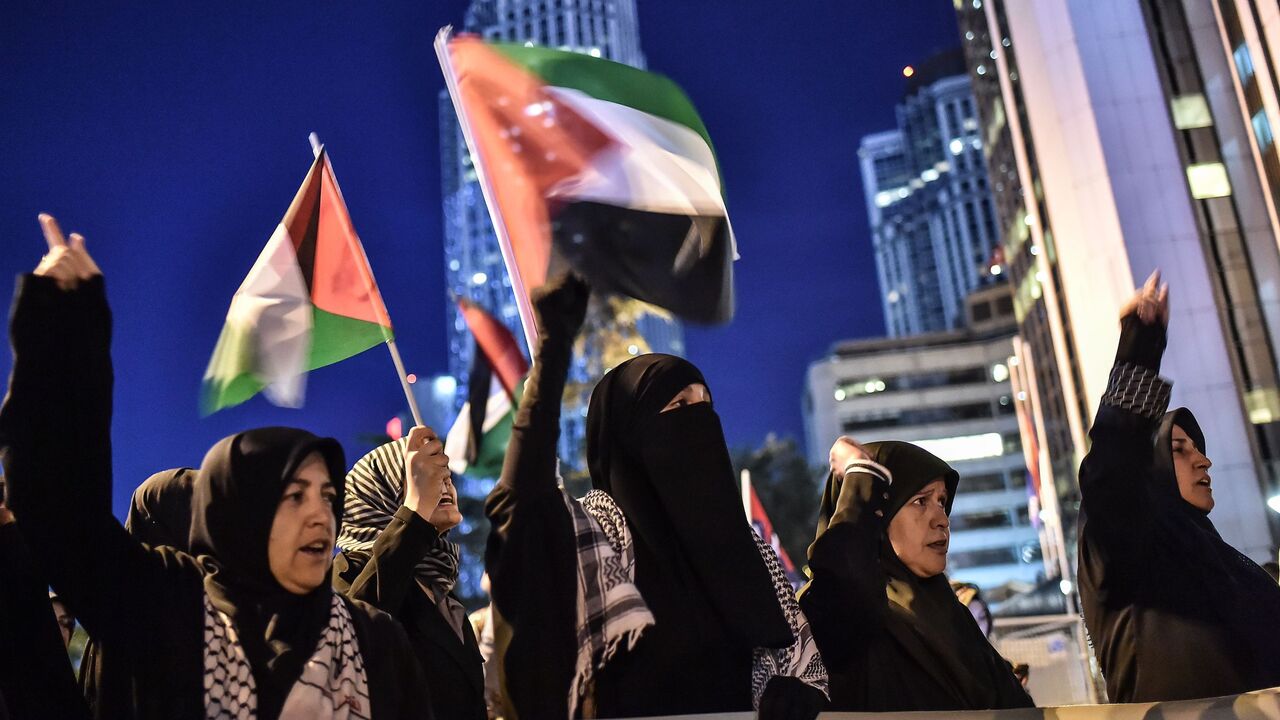 TOPSHOT - Protestors wave Palestinian flags in front of Israel consulate in Istanbul on May 15, 2018 during a protest against the killing, the day before, of 59 Palestinians in clashes and protests, on the same day as the United States formally moved its embassy in Israel to Jerusalem from Tel Aviv in defiance of international outrage. (Photo by OZAN KOSE / AFP)        (Photo credit should read OZAN KOSE/AFP via Getty Images)