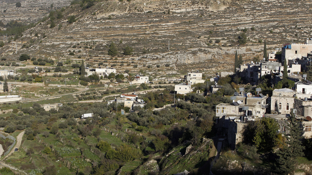 PALESTINIANS-ISRAEL/BARRIER Terraced agricultural fields are seen in Battir village, south of Jerusalem, December 12, 2012. An Israeli government environmental agency challenged the Defence Ministry in court on Wednesday over a section of the controversial West Bank wall that threatens Battir, an ancient Palestinian farming community. Gilo, an urban complex built in a part of the occupied West Bank that Israel captured in a 1967 Middle East war and later annexed to Jerusalem, is seen in the back. REUTERS/Ammar Awad (WEST BANK - Tags: