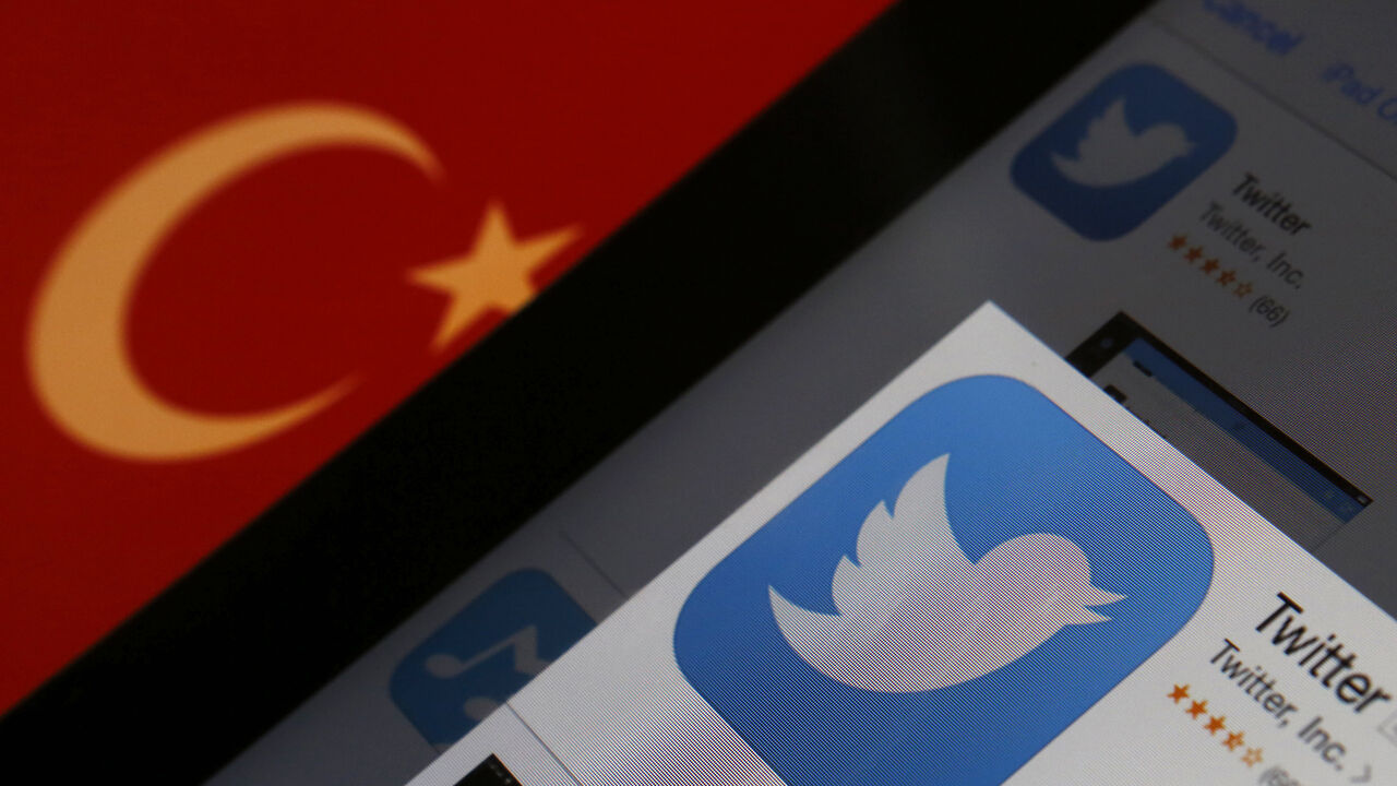A Twitter logo on an iPad display is pictured next to a Turkish flag in this photo illustration taken in Istanbul March 21, 2014. Turkey's courts have blocked access to Twitter a little over a week before elections as Prime Minister Tayyip Erdogan battles a corruption scandal that has seen social media awash with alleged evidence of government wrongdoing. The ban came hours after a defiant Erdogan, on the campaign trail ahead of key March 30 local elections, vowed to "wipe out" Twitter and said he did not c