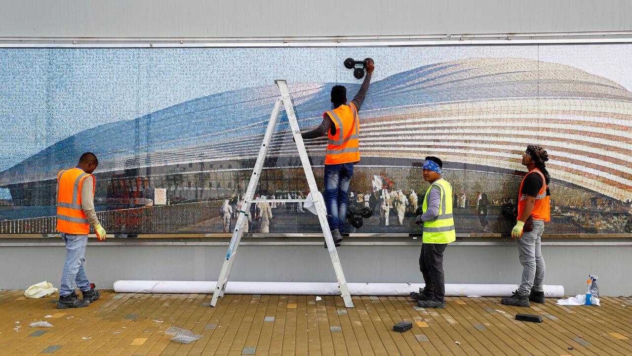 Workers are seen at the Al Janoub Stadium built for the upcoming 2022 FIFA World Cup soccer championship during a stadium tour in Al Wakrah, Qatar, December 16, 2019.  REUTERS/Corinna Kern - RC2EWD9VPND9