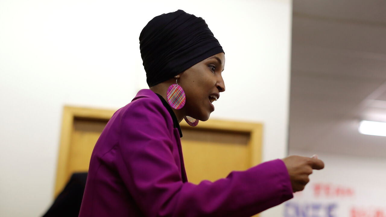 U.S. Representative Ilhan Omar (D-MN) greets campaign volunteers for Democratic 2020 U.S. presidential candidate and U.S. Senator Bernie Sanders in Des Moines, Iowa, U.S., January 31, 2020. REUTERS/Mike Segar - RC2ARE9735J8