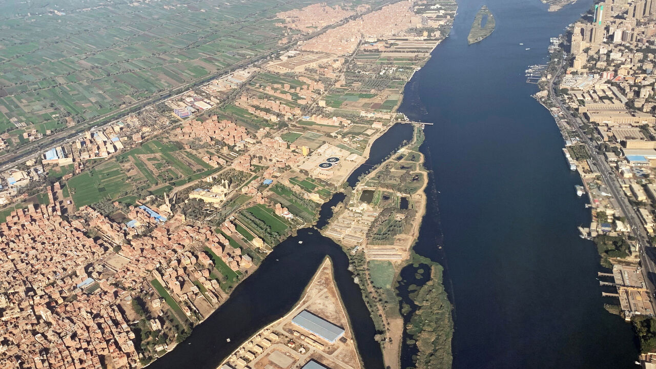 A view from an airplane window shows buildings around the Nile River in Cairo, Egypt March 10, 2020. REUTERS/Mohamed Abd El Ghany - RC25HF9RMT2R