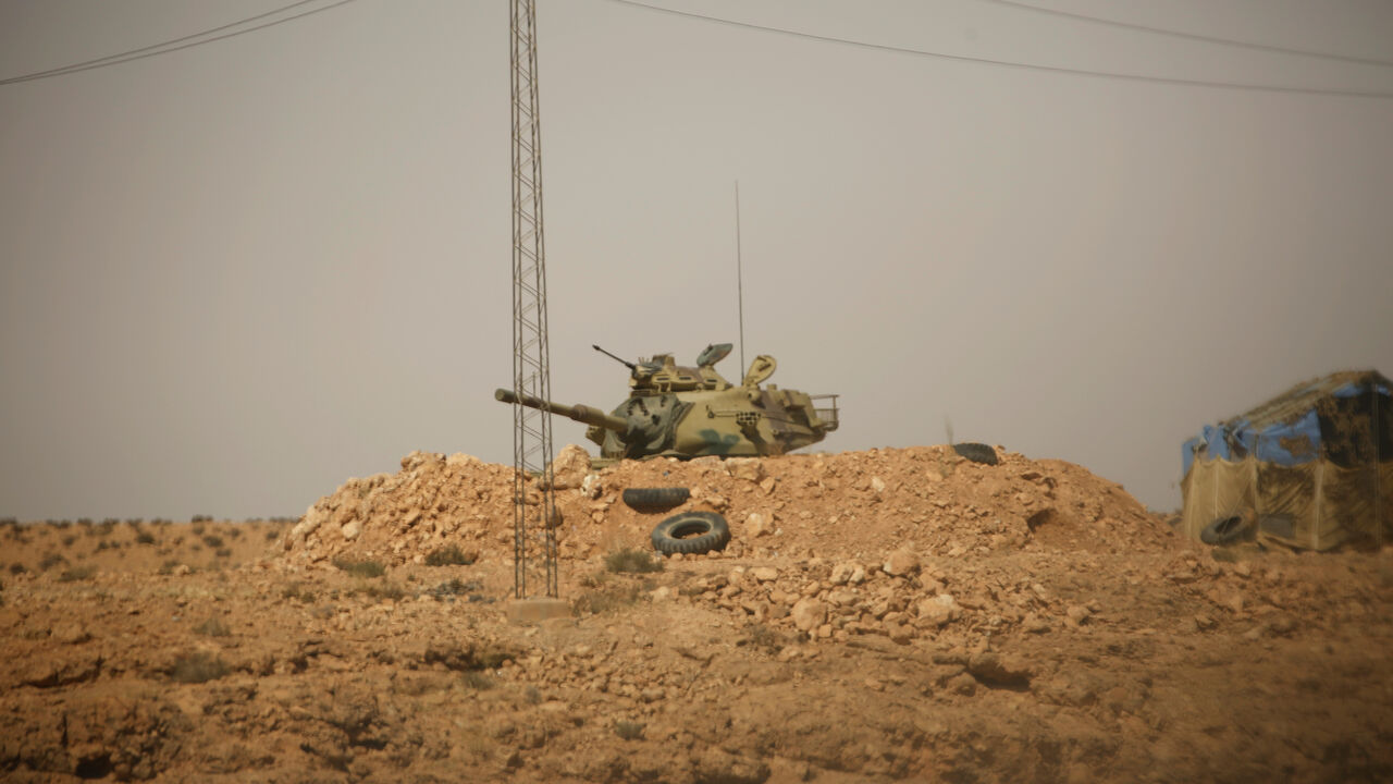 A Tunisian security forces tank is seen through a car window at Dhiba by the Tunisian and Libyan border crossing, Tunisia April 11, 2016. Tunisia's 2011 uprising created fertile ground for jihadist recruiters. Hundreds of Islamist militants were freed from prison as part of an amnesty for those detained under Ben Ali. Ultra-conservative salafists began to flex their muscle, seizing control of mosques and clashing with secularists. As Tunisia's politics have stabilised, the government has reasserted control,