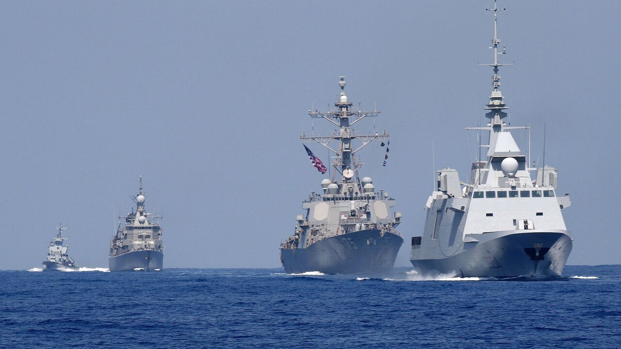 1160458548 A photo taken on August 7, 2019, shows the French anti-submarine frigate FREMM Auvergne (R) and the US Navy USS Donald Cook class guided missile destroyer (2R) and the Greek HS Aigaion frigate (2L) during an exercise how simulate a humanitarian response to a powerful earthquake and significant movement of IDF vessels and foreign vessels in the Mediterranean sea. - Sailors from France, Greece and the United States arrived on their vessels and were joined by the Israelis off the Israeli port city of Haifa for
