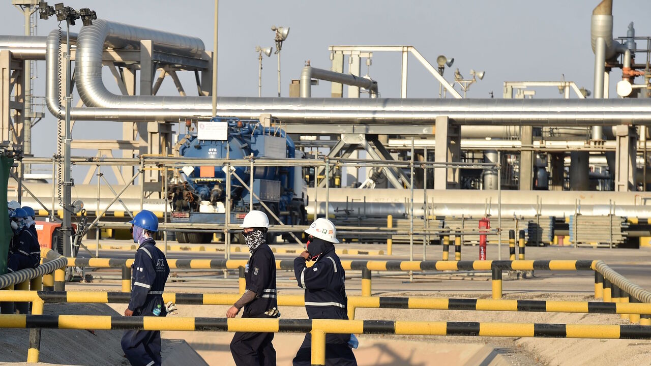 1169841468 Employees of Aramco oil company work in Saudi Arabia's Abqaiq oil processing plant on September 20, 2019. - Saudi Arabia said on September 17 its oil output will return to normal by the end of September, seeking to soothe rattled energy markets after attacks on two instillations that slashed its production by half. The strikes on Abqaiq - the world's largest oil processing facility - and the Khurais oil field in eastern Saudi Arabia roiled energy markets and revived fears of a conflict in the tinderbox Gulf
