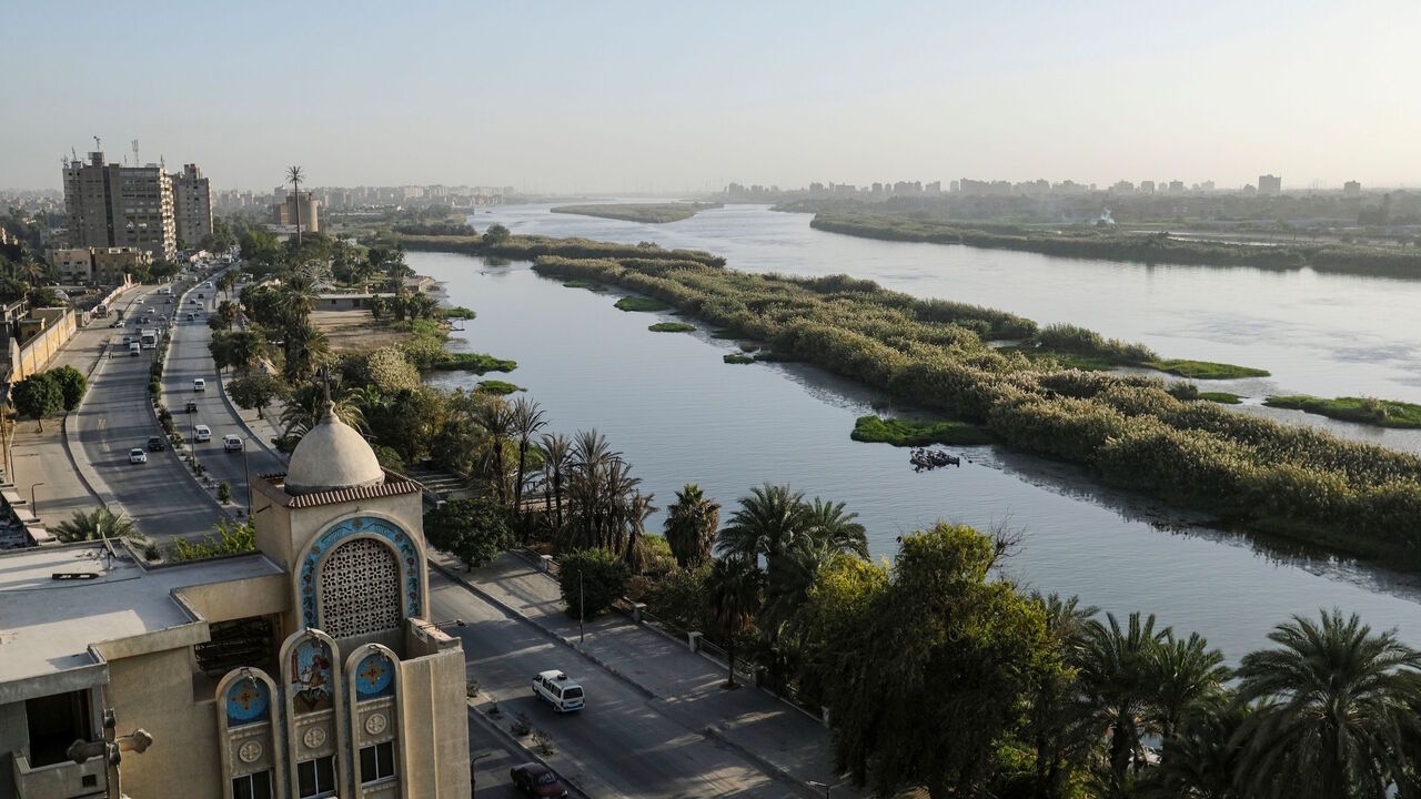 1186236072 This picture taken on November 26, 2019 shows a view of the church of the Coptic Orthodox Church of Saint George and its adjacent service building, overlooking the Nile river in the Egyptian capital Cairo's southern suburb of Kozzika, about 15 kilometres south of the city centre. - Egypt has for years been suffering from a severe water crisis that is largely blamed on population growth. Mounting anxiety has gripped the already-strained farmers as the completion of Ethiopia's gigantic dam on the Blue Nile, a