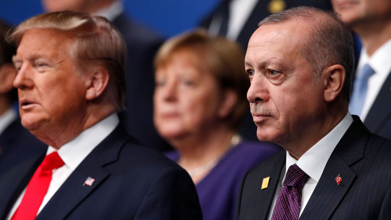 1186404656 US President Donald Trump (L) and Turkey's President Recep Tayyip Erdogan (R) pose for the family photo at the NATO summit at the Grove hotel in Watford, northeast of London on December 4, 2019. (Photo by PETER NICHOLLS / various sources / AFP) (Photo by PETER NICHOLLS/AFP via Getty Images)