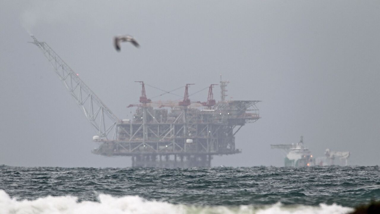 1191103531 The platform of the Leviathan natural gas field in the Mediterranean Sea which started production today is pictured from the Israeli northern coastal city of Dor on December 31, 2019. - Israel's offshore Leviathan field started pumping gas today in what the operating consortium called "a historic turning point in the history of the Israeli economy."
A joint statement from partners Noble Energy, Delek Drilling, and Ratio said that the start of production was expected to lead to an immediate reduction in dome