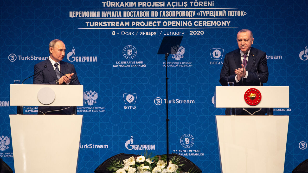 1198247462 ISTANBUL, TURKEY - JANUARY 08: Russian President Vladimir Putin (L) and Turkish President Recep Tayyip Erdogan (R) talk onstage at the opening ceremony of the Turkstream Gas Pipeline Project on January 08, 2020 in Istanbul, Turkey. The TurkStream project comprises two underwater gas lines, each with an annual capacity of 15.75 billion cubic meters. Gas will initially flow to Turkey, while a combination of existing and new pipelines will subsequently take supplies via Bulgaria to Serbia and then on to Hungar