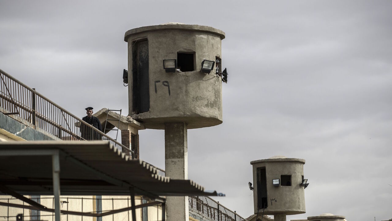 1200174849 A picture taken during a guided tour organised by Egypt's State Information Service on February 11, 2020, shows an Egyptian policeman near watch towers at Tora prison in the Egyptian capital Cairo. (Photo by Khaled DESOUKI / AFP) (Photo by KHALED DESOUKI/AFP via Getty Images)