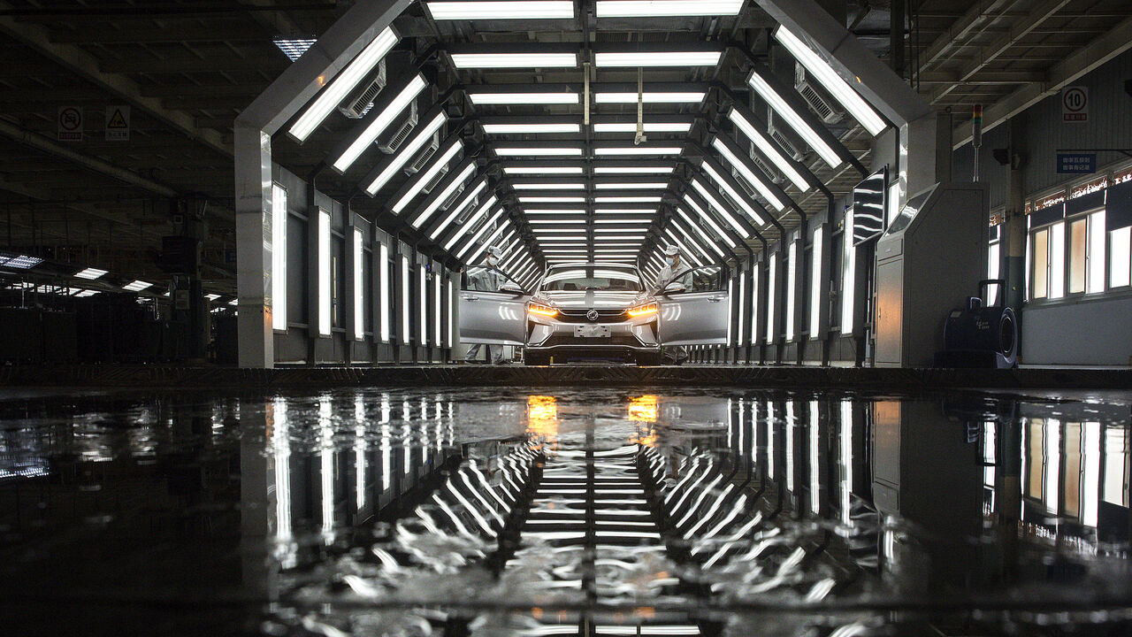 1214502429 WUHAN, CHINA - MARCH 24: (CHINA OUT) An employee works on the assembly line at the Dongfeng Fengshen plant on March 24, 2020 in Wuhan, Hubei province, China. Wuhan has allowed car producers and auto part suppliers to resume work recently. The Dongfeng Passenger Vehicle Company has resumed production following epidemic prevention and control rules. Local media have reported that Wuhan will lift the lockdown on April 8. (Photo by Getty Images)