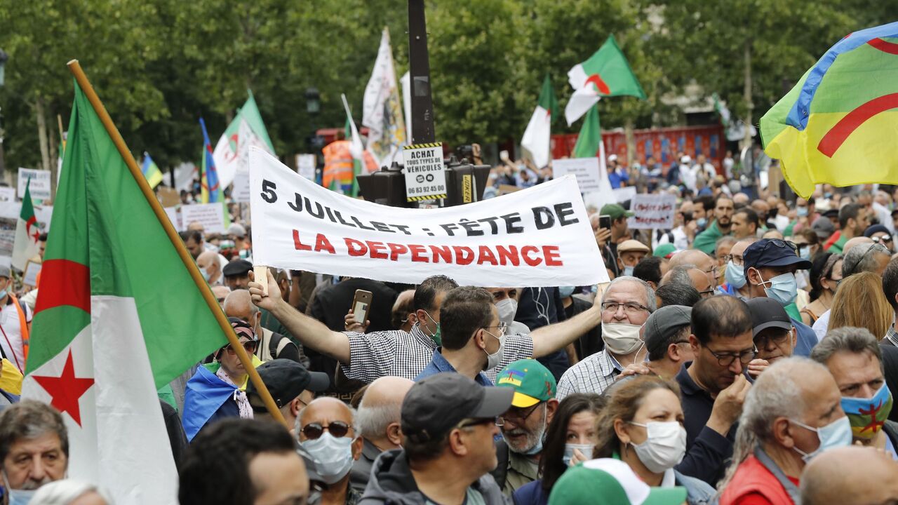1224876515 People attend a demonstration in Paris on July 5, 2020 in support of Algeria's Hirak key protest movement as Algeria celebrates today the anniversary of its 1962 independence from France. (Photo by FRANCOIS GUILLOT / AFP) (Photo by FRANCOIS GUILLOT/AFP via Getty Images)