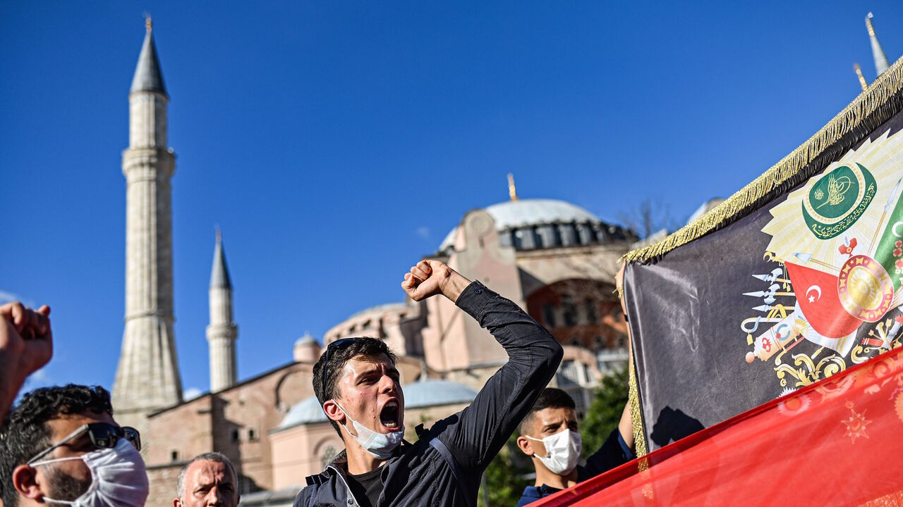 1226031570 People gather to celebrate outside the Hagia Sophia museum on July 10, 2020 in Istanbul after a top Turkish court revoked the sixth-century Hagia Sophia's status as a museum, clearing the way for it to be turned back into a mosque. - The Council of State, the country's highest administrative court which on July 2 debated a case brought by a Turkish NGO, cancelled a 1934 cabinet decision and ruled the UNESCO World Heritage site would be reopened to Muslim worshipping. The sixth-century Istanbul building -- a