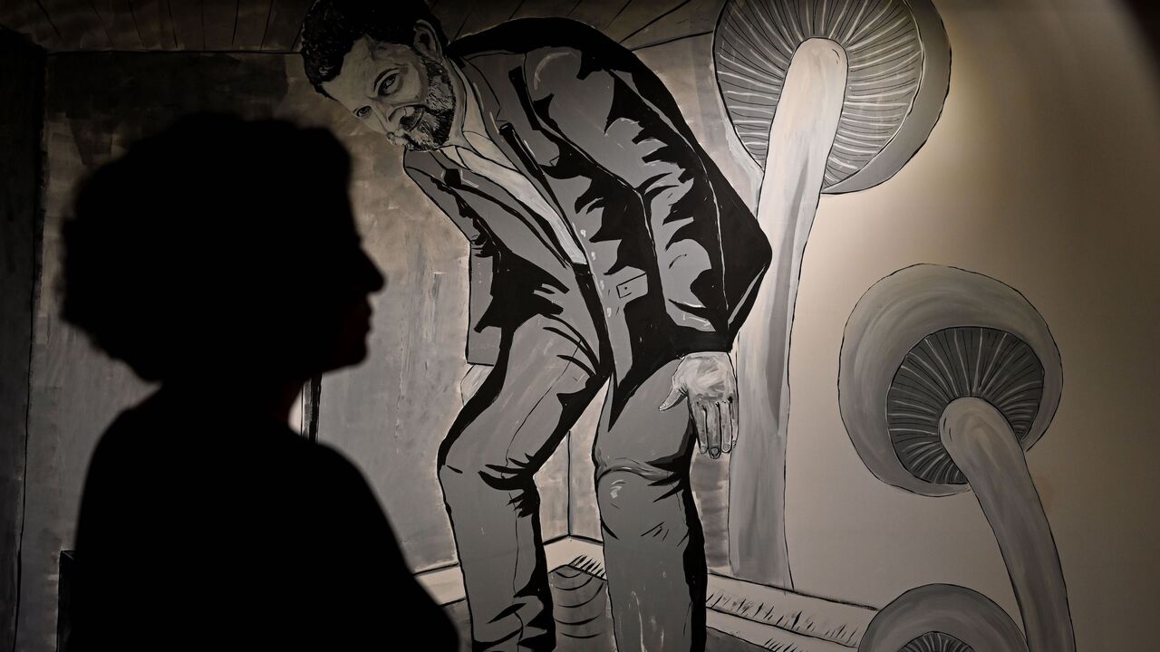 1227782828 Director general of the Anatolian Culture Asena Gunal stands in front of Osman Kavala's portrait during an interview at Anatolian Cultur Center on February 26, 2020 in Istanbul. - Osman Kavala, imprisoned in Turkey for nearly three years now without ever being convicted of a crime, is a philanthropist and businessman. (Photo by Ozan KOSE / AFP) / RESTRICTED TO EDITORIAL USE - MANDATORY MENTION OF THE ARTIST UPON PUBLICATION - TO ILLUSTRATE THE EVENT AS SPECIFIED IN THE CAPTION (Photo by OZAN KOSE/AFP via Ge