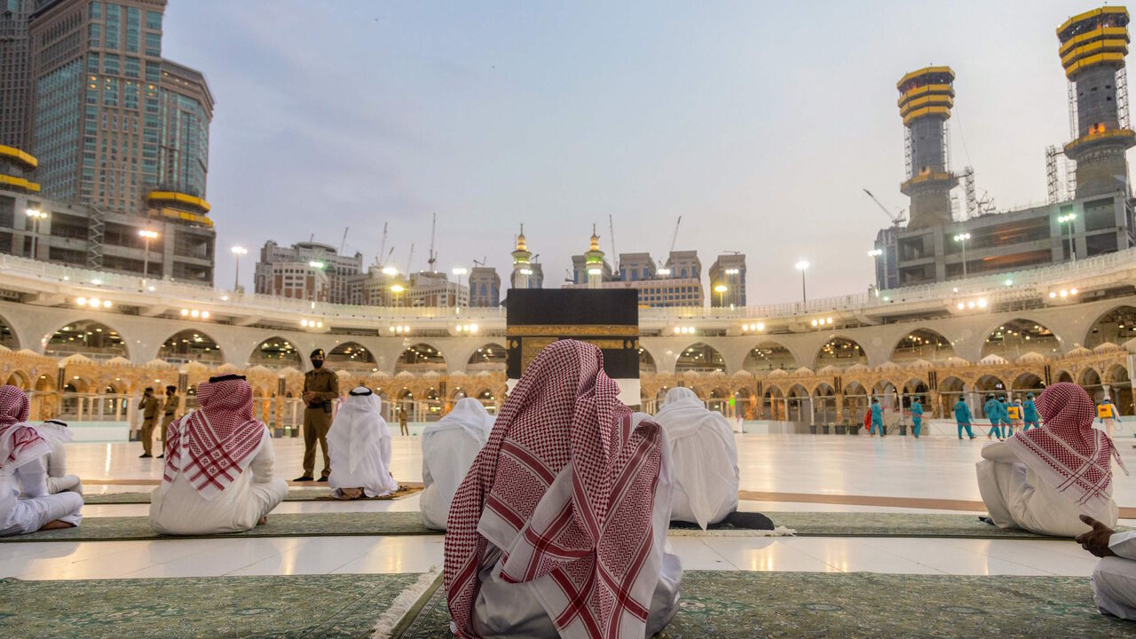 1227801118 A handout picture provided by the Saudi Ministry of Media shows members of the hajj staff gathering around the Kaaba, Islam's holiest shrine, at the Grand Mosque in the holy city of Mecca, on July 26, 2020, amid preparations for the Hajj pilgrimage season. (Photo by - / Saudi Ministry of Media / AFP) (Photo by -/Saudi Ministry of Media/AFP via Getty Images)