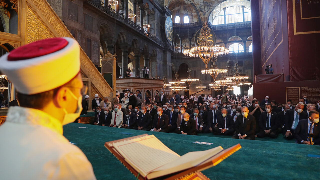 1257997457 ISTANBUL, TURKEY - JULY 24: In this handout picture released by the Turkish Presidential press office, Turkey's President Recep Tayyip Erdogan and invited guests attend Friday prayers at Hagia Sophia Grand Mosque during the buildings first official prayers after being reconverted into a mosque on July, 24, 2020 in Istanbul, Turkey. (Photo by Handout/Turkish Presidential Press Office/Getty Images)
