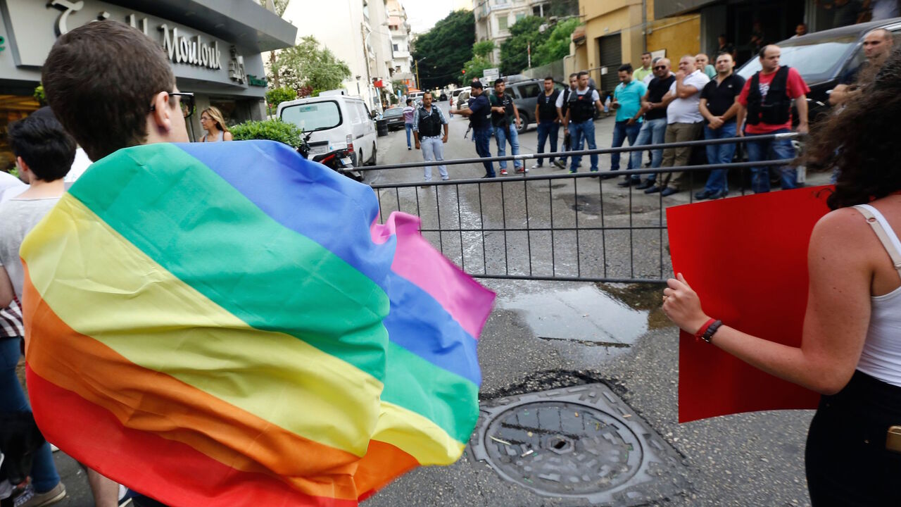 531590036 Activists from of the Lebanese LGBT community take part in a protest outside the Hbeish police station in Beirut on May 15, 2016, demanding the release of four transsexual women and calling for the abolishment of article 534 of the Lebanese Penal code, which prohibits having sexual relations that "contradict the laws of nature". / AFP / ANWAR AMRO (Photo credit should read ANWAR AMRO/AFP via Getty Images)
