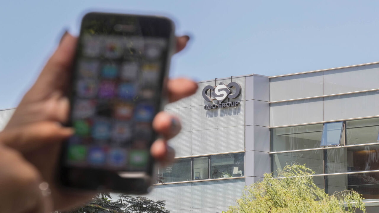 596871450 An Israeli woman uses her iPhone in front of the building housing the Israeli NSO group, on August 28, 2016, in Herzliya, near Tel Aviv.
Apple iPhone owners, earlier in the week, were urged to install a quickly released security update after a sophisticated attack on an Emirati dissident exposed vulnerabilities targeted by cyber arms dealers.
Lookout and Citizen Lab worked with Apple on an iOS patch to defend against what was called "Trident" because of its triad of attack methods, the researchers said in a