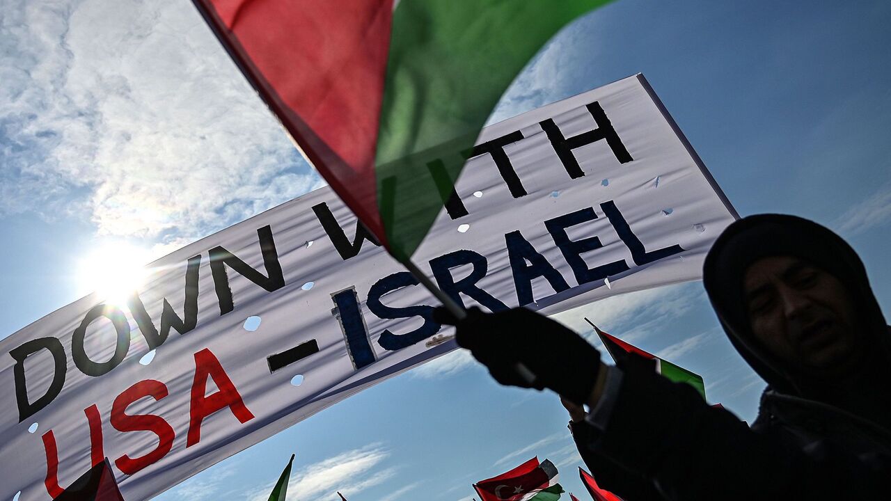 1199627056 Demonstrators wave Turkish and Palestinian flags during a rally at Yenikap? Square, in Istanbul, to protest against the US-made peace plan, also known as the Agreement of the Century,on Februay 9, 2020. (Photo by Ozan KOSE / AFP) (Photo by OZAN KOSE/AFP via Getty Images)