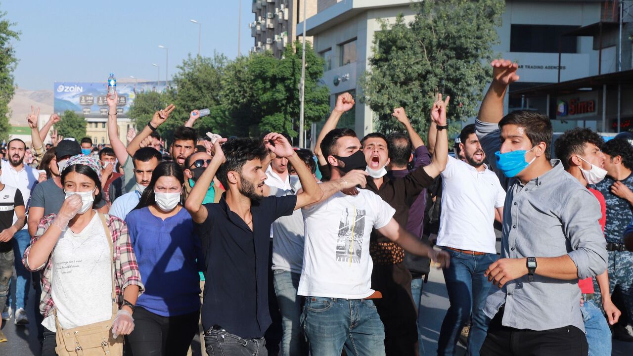 1221007586 Iraqi kurds, some of them wearing protective masks due to COVID-19, march during a demonstration to denounce the Turkish assault in northern Iraq, in Sulaimaniyah city, in the Kurdish autonomous region of northern Iraq, on June 18, 2020. - Turkey launched a rare ground assault into northern Iraq on June 17, deploying special forces against rebels from the Kurdistan Workers' Party (PKK) which is blacklisted by Ankara as a "terrorist" group. Baghdad demanded Ankara immediately halt its assault in northern Ira