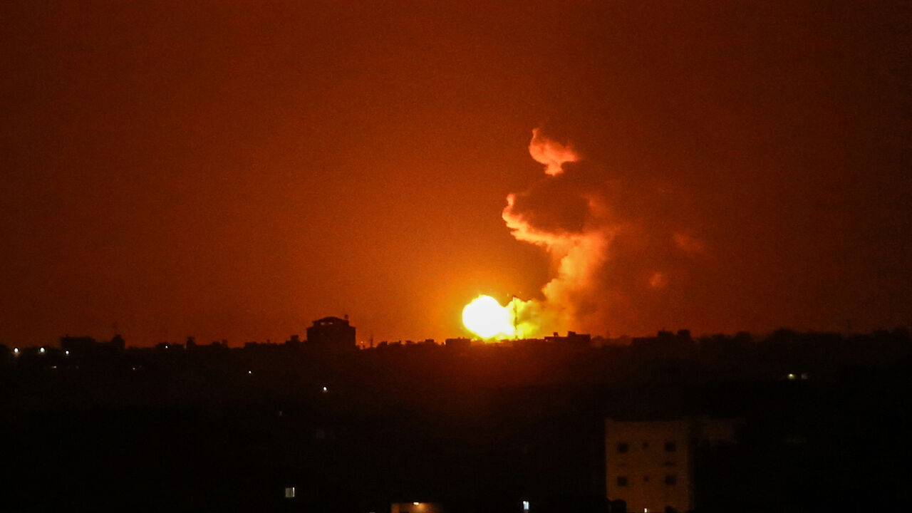 1223044821 A ball of fire is seen following an Israel airstrike at Khan Yunis in the southern Gaza Strip early on June 27, 2020. - Two rockets were fired from the Hamas-controlled Gaza Strip towards Israeli territory on June 26, the army said. It was the first reported rocket fire from the Gaza Strip since early May. (Photo by SAID KHATIB / AFP) (Photo by SAID KHATIB/AFP via Getty Images)