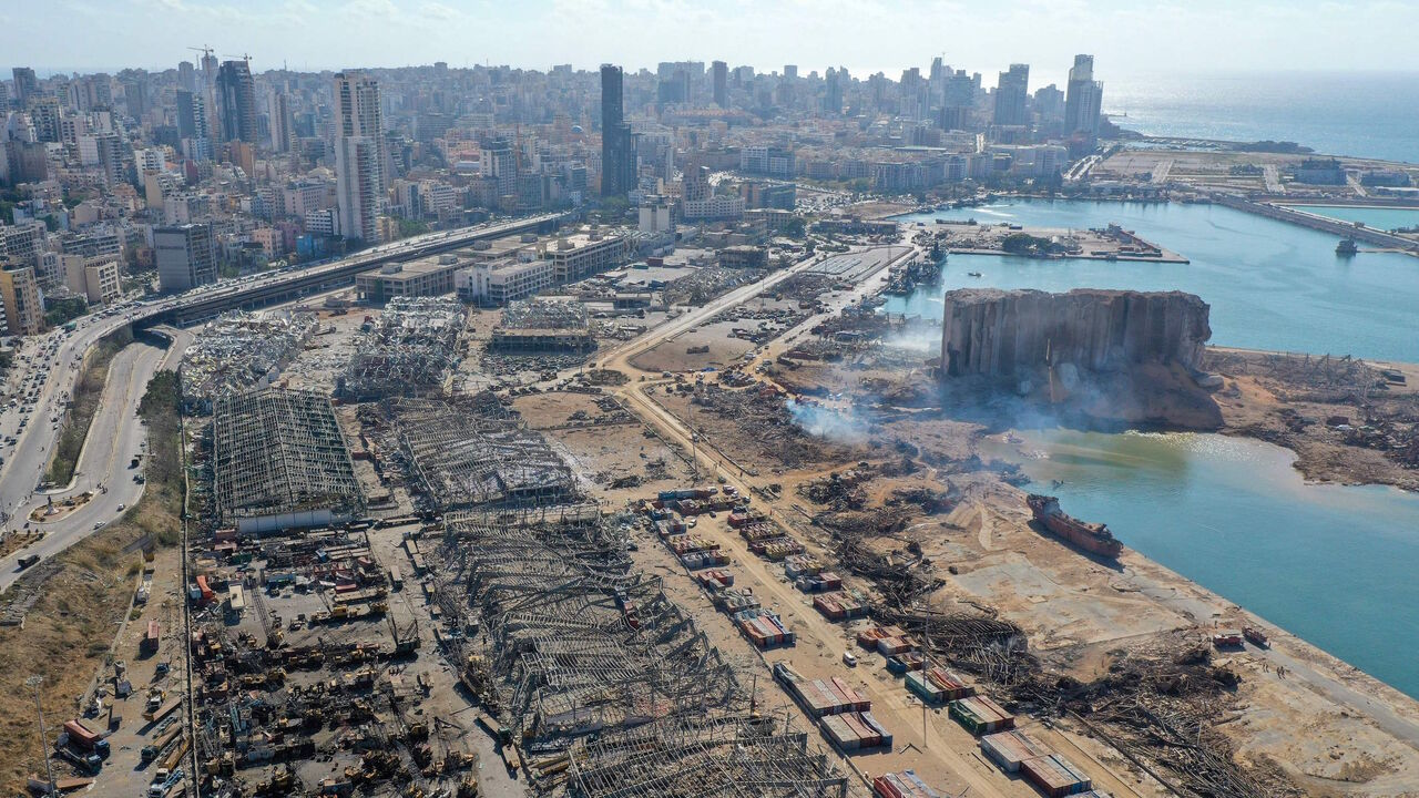 1227922518 An aerial view shows the massive damage done to Beirut port's grain silos (C) and the area around it on August 5, 2020, one day after a mega-blast tore through the harbour in the heart of the Lebanese capital with the force of an earthquake, killing more than 100 people and injuring over 4,000. - Rescuers searched for survivors in Beirut in the morning after a cataclysmic explosion at the port sowed devastation across entire neighbourhoods, killing more than 100 people, wounding thousands and plunging Leban