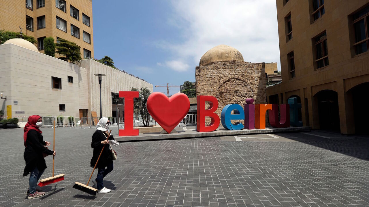 1227933056 Volunteers clean the rubble and broken glass from the streets in DT Beirut on August 6, 2020 in the aftermath of a massive explosion in the Lebanese capital. (Photo by JOSEPH EID / AFP) (Photo by JOSEPH EID/AFP via Getty Images)