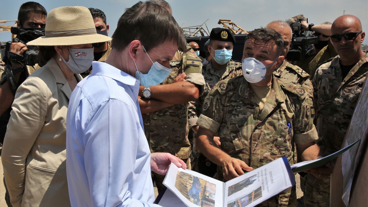 1228053201 US Undersecretary of State for Political Affairs David Hale (2-L) and US Ambassador to Lebanon Dorothy Shea (L), accompanied by Lebanese army officers, tour at the site of last week's explosion that hit the seaport of the Lebanese capital Beirut, on August 15, 2020. - Hale today called for a transparent and credible probe into the explosion at Beirut's port, as FBI investigators were set to arrive in Lebanon to assist authorities. (Photo by NABIL MOUNZER / POOL / AFP) (Photo by NABIL MOUNZER/POOL/AFP via Ge