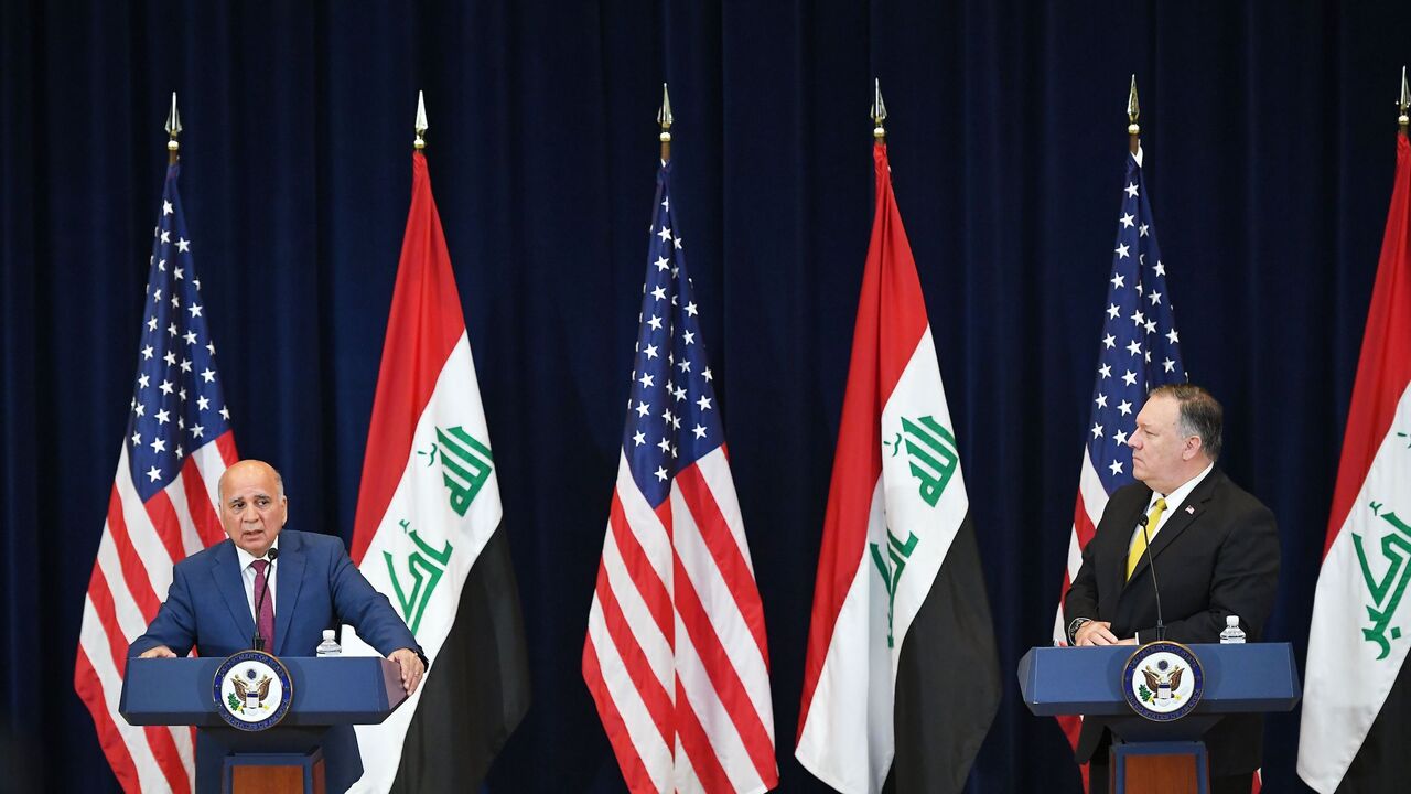 1228106987 Iraq's Foreign Minister Fuad Hussein (L) speaks during a press conference with US Secretary of State Michael Pompeo at the State Department in Washington, DC on August 19, 2020. (Photo by MANDEL NGAN / AFP) (Photo by MANDEL NGAN/AFP via Getty Images)