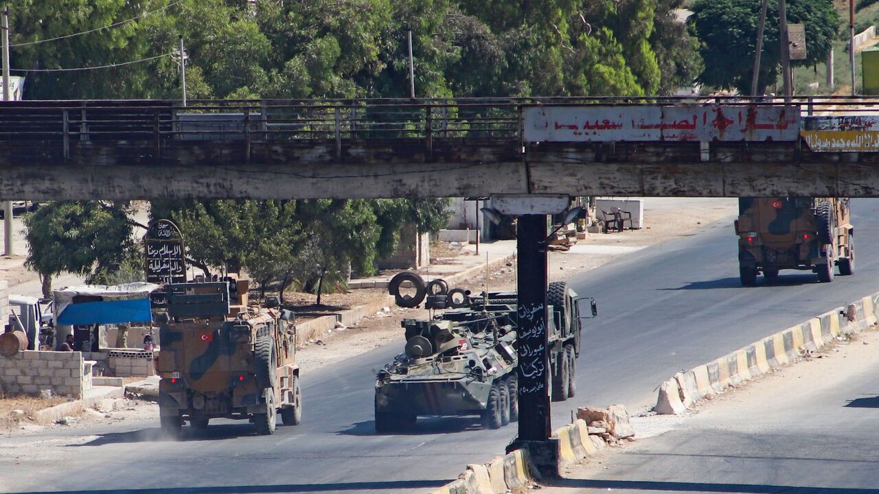 1228192361 A Turkish-Russian military convoy tows a damaged vehicle after its joint patrol was reportedly targeted on the strategic M4 highway, near the Syrian town of Urum al-Jawz in the south of the northwestern Idlib province, on August 25, 2020. - Russia and Turkey launched joint patrols along the M4 highway in March following a ceasefire agreement aimed at stopping heavy fighting in and around Idlib, the last major bastion of anti-government forces in Syria's civil war. (Photo by Abdulaziz KETAZ / AFP) (Photo by
